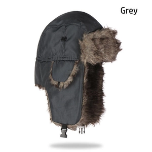 Detail showing windproof grey winter trapper hat with thick faux fur lining and ear flaps