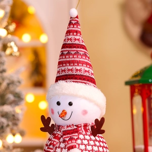Close-up of a plush Christmas snowman with red knitted hat and plaid scarf details