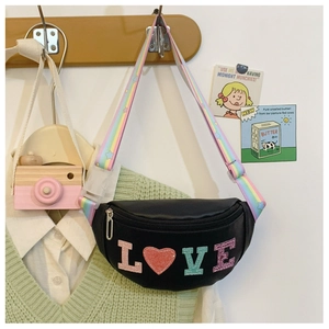 Detail of black leather kids waist bag with rainbow star strap and LOVE heart logo