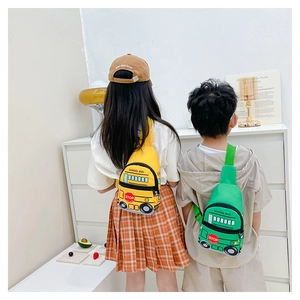 Rear view of children wearing cute school bus shaped yellow and green chest bags