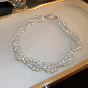 French vintage multilayer pearl necklace with twisted strands on jewelry tray