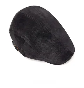 Top view of black newsboy cap showing suede texture and adjustable metal side buckle
