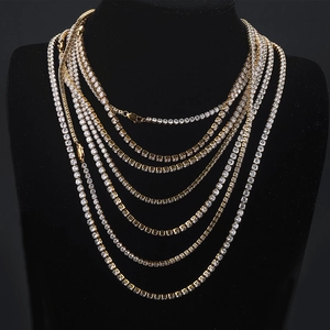 Hip hop gold plated tennis necklace set with sparkling zircons on a black bust