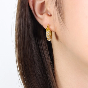 Luxury gold huggie earrings with four rows of sparkling cubic zirconia stones