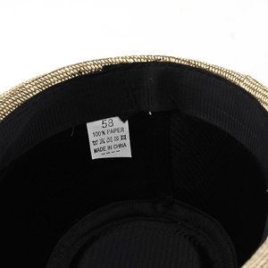 Close-up of internal sweatband and size label for men's vintage straw jazz hat