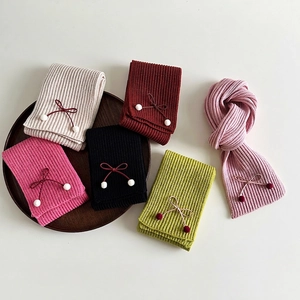 Knitted scarves with bow ties and pom-poms in six assorted colors for kids and women