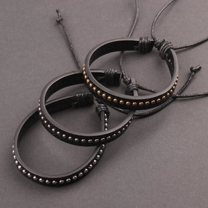 Three-piece black leather punk bracelets set with gold and silver metal rivet studs