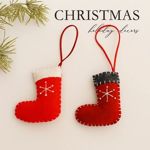 Red felt Christmas stocking ornaments with white snowflake embroidery and hanging loops