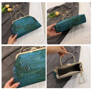Detail view of peacock blue silk evening bag with gold clasp and chain strap