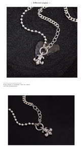 Detail of S925 silver fleur-de-lis pendant with hybrid bead and link chain necklace