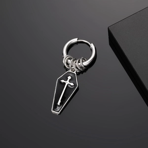 Gothic punk earring detail showing black coffin pendant with silver cross and metal rings