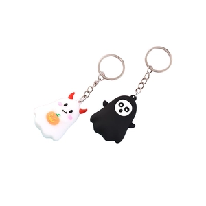 Cartoon Halloween ghost keychains with pumpkin and bat motifs in black and white silicone