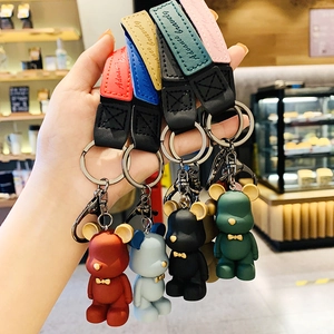 Nordic bow-tie bear keychain with leather strap in various colors for bags and cars