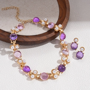 Vintage gold necklace and earrings set with purple resin stones and white pearls