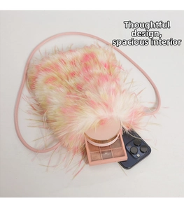 Detail view of the colorful faux fur crossbody bag showing interior storage for makeup and phone