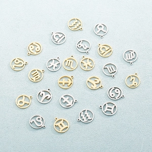 Set of 24 gold and silver stainless steel 12 zodiac charms with hollow round design