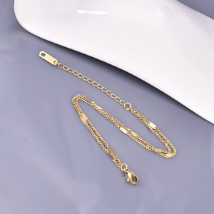 Minimalist double-layered gold chain bracelet with K18 tag and lobster clasp detail