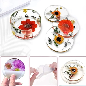 Detailed view of dried flower resin coasters and flexible silicone storage box molds
