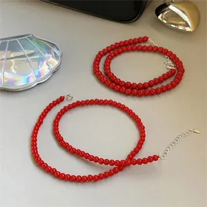 Detailed view of minimalist red beaded necklaces with 925 silver clasps