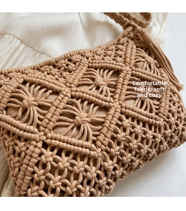 Close-up of beige woven cotton rope bag featuring intricate patterns and side tassels