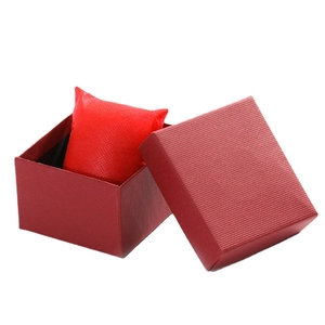 Elegant red textured paper watch gift box with matching cushion on white background