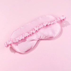 Pink silk sleeping eye mask with elastic headband for light blocking and eye protection