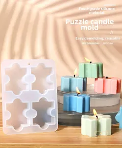 Detail van puzzel siliconen mal met afgewerkte kleurrijke hars kaarsen op hout