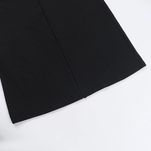 Detailed macro view of the fine knit texture and neat stitching on a black mesh dress hem
