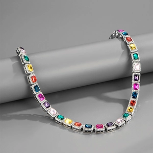 Detail of 10mm Cuban link necklace with multicolor rectangular stones and silver finish