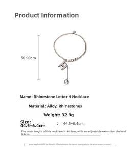 Detail view of silver H pendant necklace with rhinestone settings and measurement specs