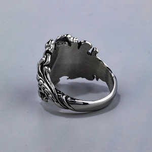 Retro stainless steel skull ring with ocean wave engraving in a vintage punk style