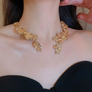 Detail of leaf-shaped champagne crystal choker necklace on a model for gala wear