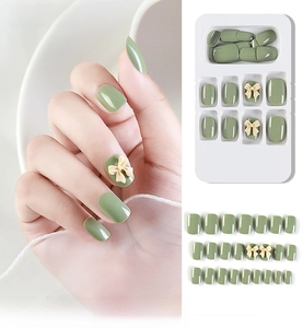 Detailed set of 24pcs avocado green press-on nails with 3D cream bow-knot design