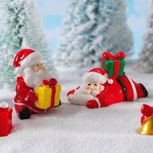Miniature resin Santa Claus figures with gift boxes on snow for Christmas desk decor