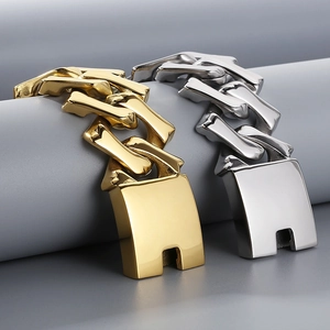 Macro view of gold and silver bone-link hip hop bracelets with mirror finish