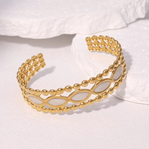 Bracelet ouvert en acier inoxydable doré 18k avec incrustations marquise et bord perlé