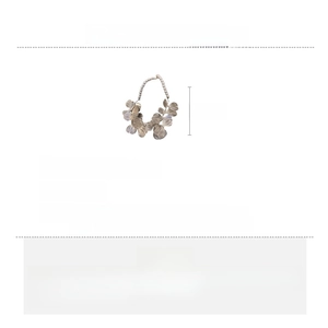 Detailed view of the gold flower necklace showing the 34.7g weight and copper material
