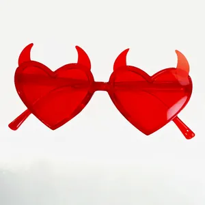 Retro heart shaped devil horn sunglasses in transparent red plastic for party fashion
