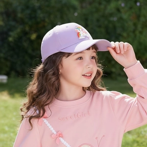 Outdoor shot of a girl wearing a light purple cotton baseball cap with a unicorn patch