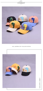Detailed close-up of kids dinosaur cotton baseball caps with embroidery and color-blocking