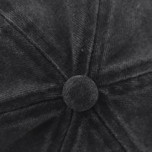 Close-up of black corduroy baseball cap crown with top button and detailed stitching