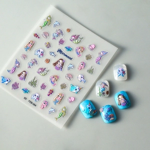 Detailed 5D embossed nail stickers featuring mermaid shells and dolphin patterns