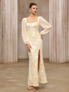 Detailed close-up of champagne evening dress with 3D floral embroidery and square neck