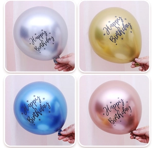 Close-up of metallic Happy Birthday balloons in silver, gold, blue and rose gold