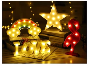 Close-up of LED decorative lights featuring LOVE letters, rainbow clouds, and stars