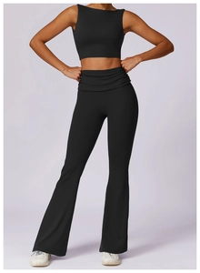 Detailed view of high-waisted flared yoga pants with stylish pleated waist design