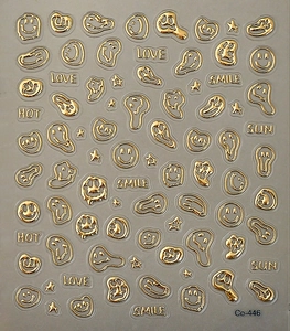 Detailed view of 3D metallic gold melting smiley face nail art stickers with text