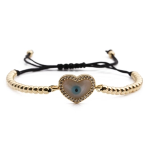 Adjustable gold heart evil eye beaded bracelet with cubic zirconia and black woven cord