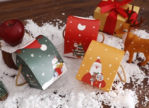 Detailed view of festive Christmas paper gift boxes with holiday character illustrations