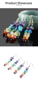 Detailed macro of handmade rainbow crystal stone drop earrings with silver hooks